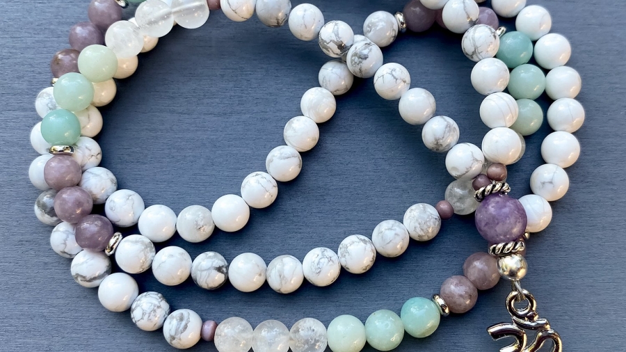 What do white beads symbolize